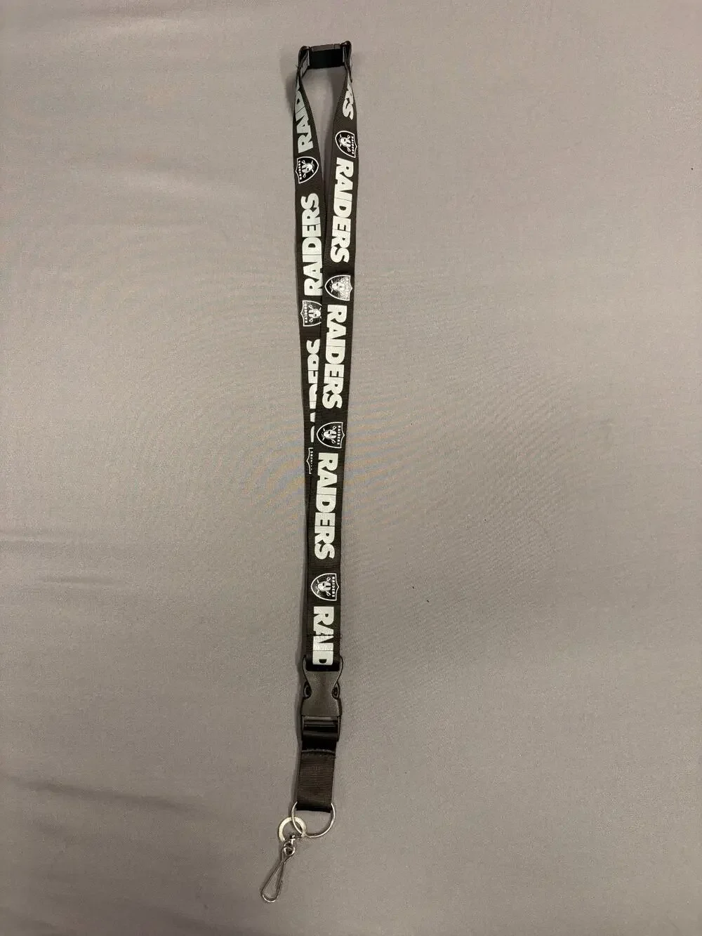 LAS VEGAS RAIDERS NFL FOOTBALL TEAM BADGE HOLDER BREAKAWAY LANYARD